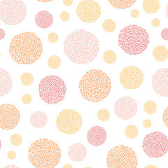 Pompom vector pattern in pastel colors, orange, red, pink, perfect for wallpaper or fabric, soft gentle seamlesss polka dot pattern.