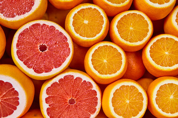 Fresh oranges and grapefruits background. Healthy and tasty nutrition