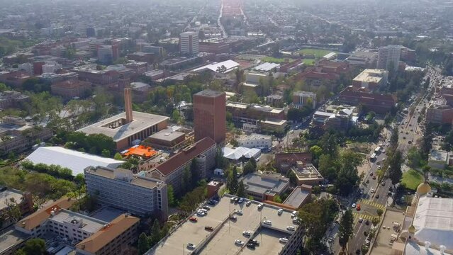 Aerial view orbiting University of Southern California campus establishment grounds, Los Angeles