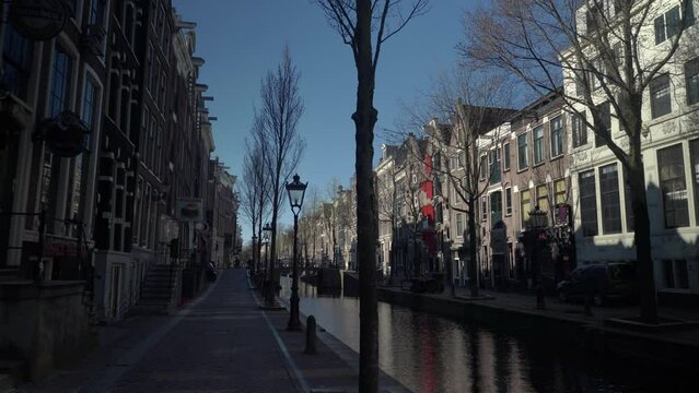 Empty street of  De Wallen famous red light district, city on quarantine due to the outbreak of coronavirus pandemic, Noord-Holland, Amsterdam, Netherlands