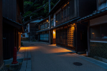 Night view of  street with traditional boathouses at Ine Town in Kyoto, Japan.
