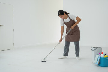 Woman, housewife mopping floor at home.