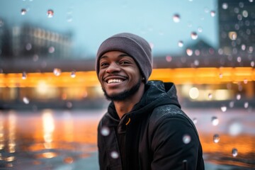 Fototapeta premium Medium shot portrait photography of a satisfied boy in his 30s wearing a warm beanie against a vibrant city fountain background. With generative AI technology