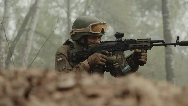 A Ukrainian soldier shoots at the enemy