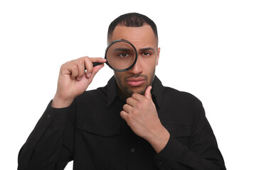 Fototapeta na wymiar Curious man looking through magnifier glass on white background