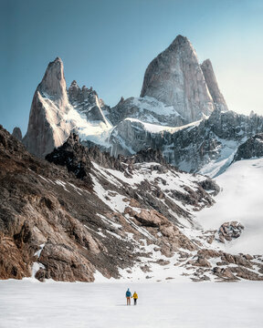 Travelers couple in love enjoying the view of majestic Mount Fitz Roy - symbol of Patagonia, Argentina
