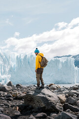 Fototapeta premium A man posing on the ice formation of the Perito Moreno glacier, Argentina