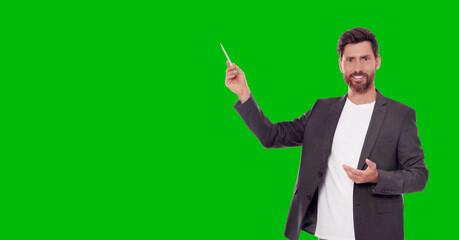 Chroma key compositing. Broadcaster against green screen, banner design