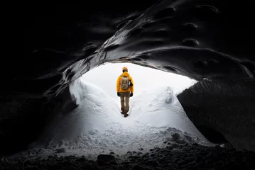 Abwaschbare Fototapete Grau 2  traveler finds himself detained in an impressive landscape of ice inside the Vatnajokull National Park, in Iceland. The dazzling ice formations and intricate patterns reveal the magnificent beauty o