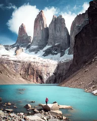 Fotobehang Cerro Chaltén A woman posing on the ice formation of the Torres del Paine, Chile