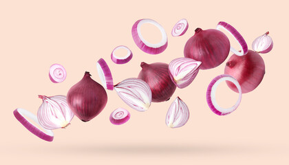 Whole and cut fresh red onions falling on light coral background