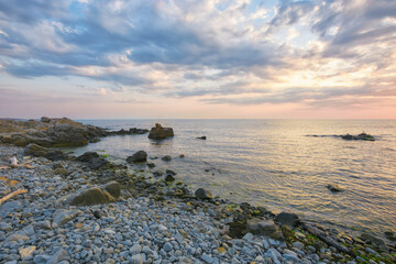 pebble coast at sunrise. gorgeous view of sozopol seascape. summer holiday at the sea