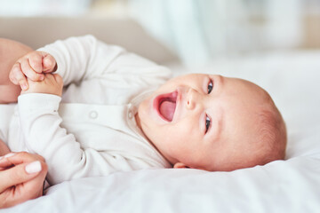 Laugh, portrait and a baby on the bed with mother for play, bonding and wake up in the morning....