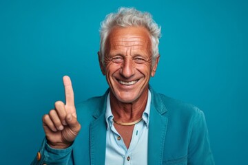 Close-up portrait photography of a joyful mature man making a peace gesture with two fingers against a turquoise blue background. With generative AI technology