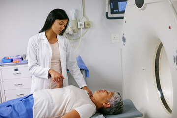 Mri, doctor and woman holding hands of patient in hospital before scanning in machine. Ct scan,...