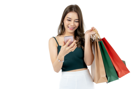 Young Asian woman using smart phone and holding shopping bag shoot in isolated white background, remove background. shopping payment concept