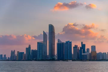 Foto auf Glas Sunrise high rise building of hotel, offices in Abu Dhabi capital, United Arab Emirates © Piak