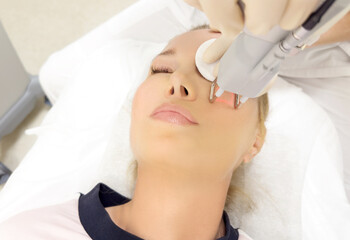 Obraz na płótnie Canvas Laser Treatment,Cosmetic Laser Dermatology ,dermatologist offices,laser technology