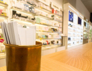 buying make up at cosmetics section in store. choosing cosmetics, perfumes, creams and shampoos, Using tester.