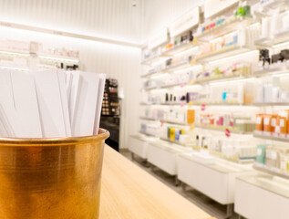 buying make up at cosmetics section in store. choosing cosmetics, perfumes, creams and shampoos, Using tester.