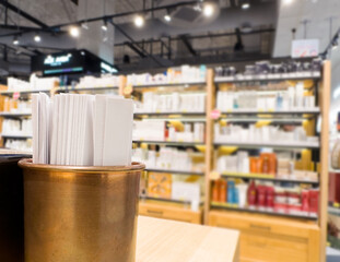 buying make up at cosmetics section in store. choosing cosmetics, perfumes, creams and shampoos, Using tester.