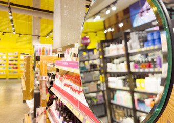 buying make up at cosmetics section in store. choosing cosmetics, perfumes, creams and shampoos, Using tester.