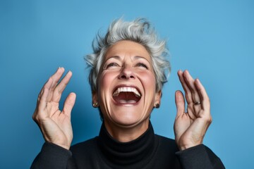 Headshot portrait photography of a joyful mature woman putting hands on the face in a gesture of terror against a sky-blue background. With generative AI technology