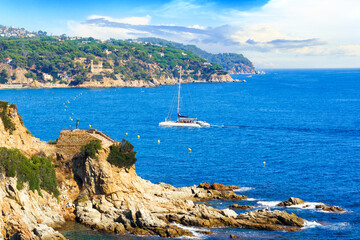 Summer landscape of the Mediterranean Sea and mountains within the city of Lloret de Mar in sunny day. Costa Brava, Girona, Catalonia, Spain