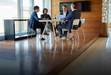 Professional, teamwork and conversation with strategy in conference room with manager at office. Discussion, business and group with meeting or brainstorming or planning at company for project.