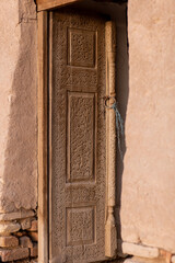 wooden door with a blue rope
