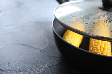 Boil corn on the pan.Heathty food.
