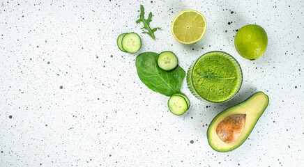 Green vegetable smoothie on a light background. Long banner format. top view