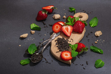 Refreshing summer drink. Dry tea leaves, fresh fruit and herbs. Set of ingredients for cooking tea