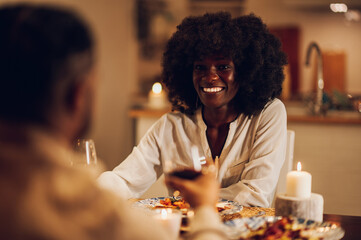 Portrait of an african american woman having a romantic date at home with her boyfriend