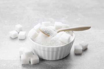 Fototapeta na wymiar Different types of white sugar on grey table