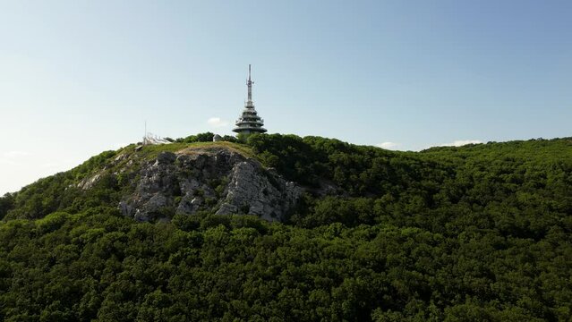 Gorgeous aerial view of the peak of Zobor Mountain and Pyramid Radio tower, 4k