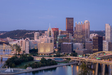 Fototapeta na wymiar Cityscape of Pittsburgh and Evening Light. Fort Pitt Bridge in the Background. Beautiful Pittsburgh Skyline