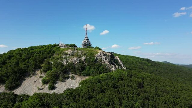Sunny day on Zobor Mountain, radio tower on top of the cliff, Slovakia, 4k