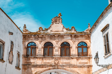 Arco Scoppa Ostuni, Brindisi, Puglia, Italy, Europe. Old town in southern Italy. Ostuni is referred to as the White Town. Ostuni white town skyline and church, Brindisi, Italy. - obrazy, fototapety, plakaty