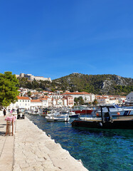 scenic view of boats in harbor against clear blue sky at Hvar, Croatia - obrazy, fototapety, plakaty