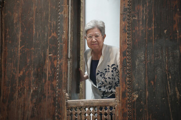 old elderly elder senior woman smiling at window