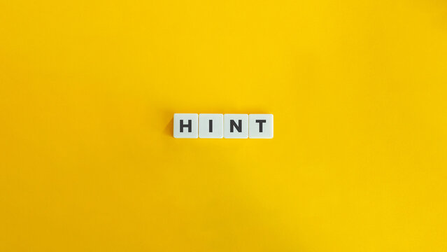 Word Hint on Block Letter Tiles on Yellow Background. Minimal Aesthetic.