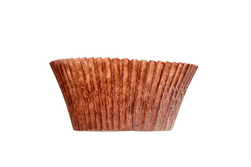 Empty cupcake baking case isolated on white background. Brown paper baking cup. Single muffin case, cupcake liner