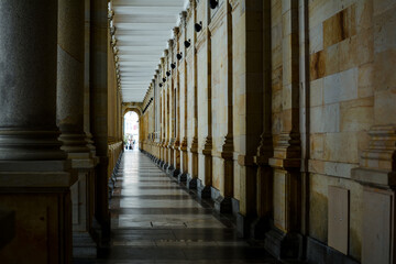 Long corridor between many columns in Mill Colonnade. Day shoot. It is a large colonnade containing...
