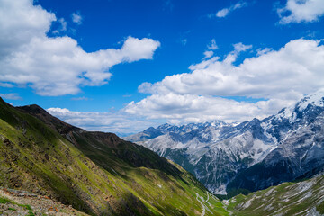 Fototapeta premium View from the Stelvio Pass, the highest automobile pass in Italy, located between Trentino-Alto Adige and Lombardy, Italy. Ecologia and photo tourism concept.