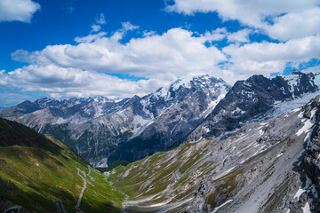 Fototapeta na wymiar View from the Stelvio Pass, the highest automobile pass in Italy, located between Trentino-Alto Adige and Lombardy, Italy. Ecologia and photo tourism concept.