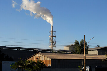 luiz eduardo magalhaes, bahia, brazil - june 5, 2023: smoke coming out of a chimney in a silage area in western bahia.