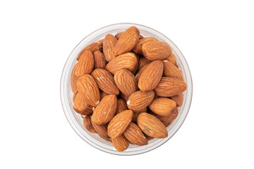 A pile of organic almonds in a glass bowl isolated on white background