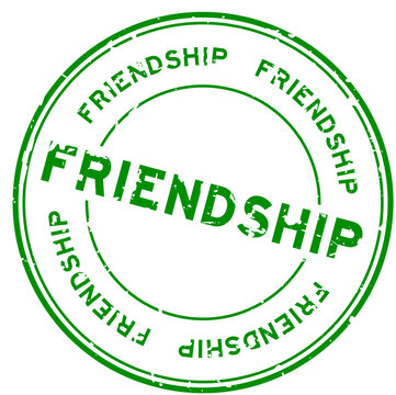 Grunge green friendship word round rubber seal stamp on white background