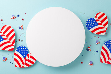 Memorial Day festivity. From above, observe symbolic embellishments: American flag patterned hearts, and confetti, placed on a pastel blue surface with an empty circle for text or promotion